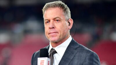 Troy Aikman with mic in hand
