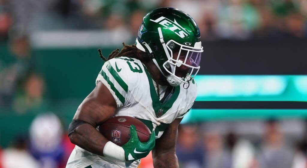 New York Jets running back Dalvin Cook running with football.