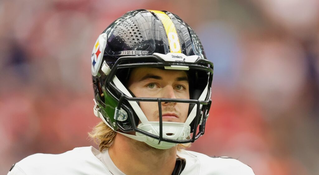 Pittsburgh Steelers quarterback Kenny Pickett looking on.