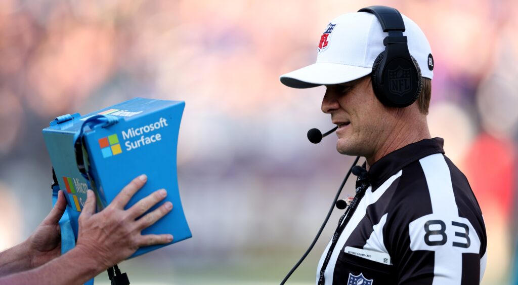 Shawn Hochuli looking at table replay