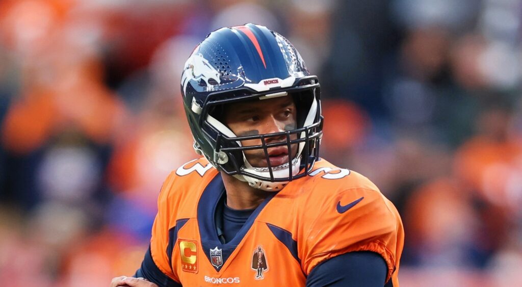 Russell Wilson of Denver Broncos looking to pass.