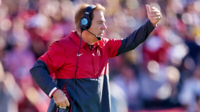 Nick Saban with a hand in the air during Rose Bowl