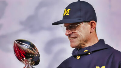 Jim Harbaugh with Leishman Trophy