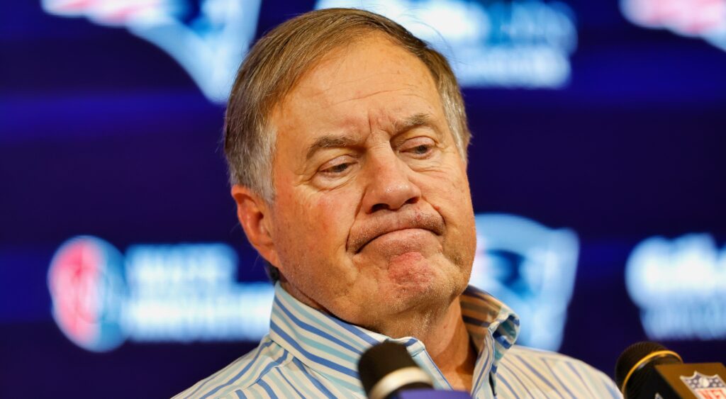 Bill Belichick looks on during a press conference.