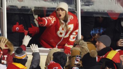 Taylor Swift greeting fans from suite