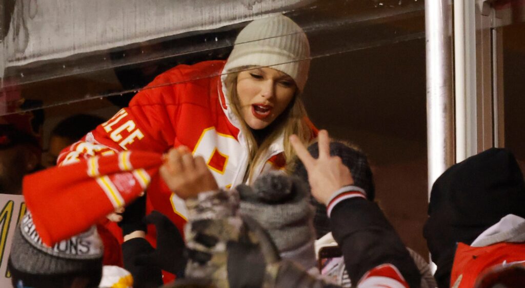 Taylor Swift greeting fans at game