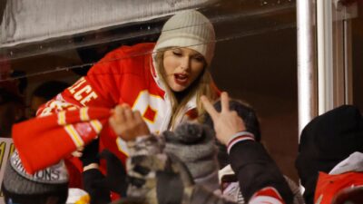 Taylor Swift greeting fans at game