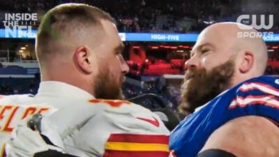 Travis Kelce and Mitch Morse sharing an embrace