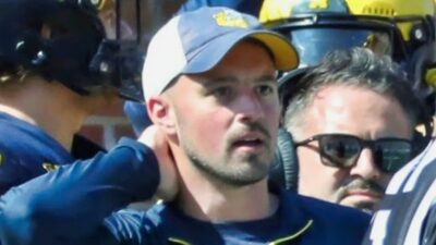 connor stalions on Michigan sidelines