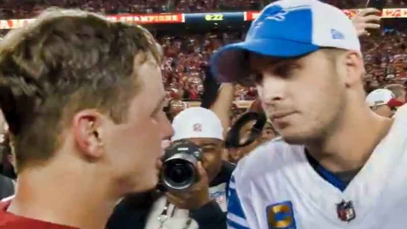 Brock Purdy (left) speaking to Jared Goff (right) after game.