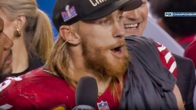 George Kittle talking to reporters during NFC Championship ceremony