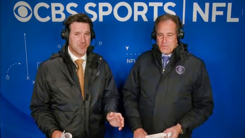 Tony Romo (left) and Jim Nantz (right) speaking in broadcast booth.