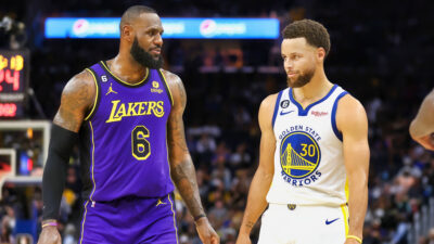 LeBron James standing next to Steph Curry