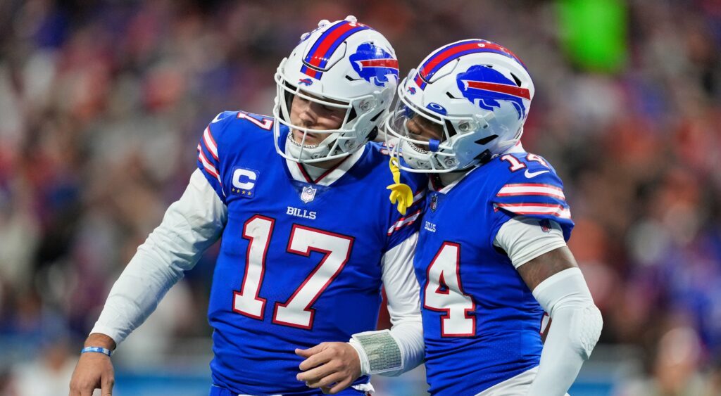 Josh Allen (left) and Stefon Diggs (right) celebrating a play.
