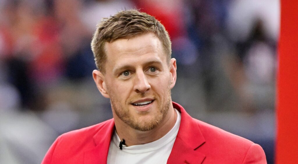 J.J. Watt looking on and speaking at event.
