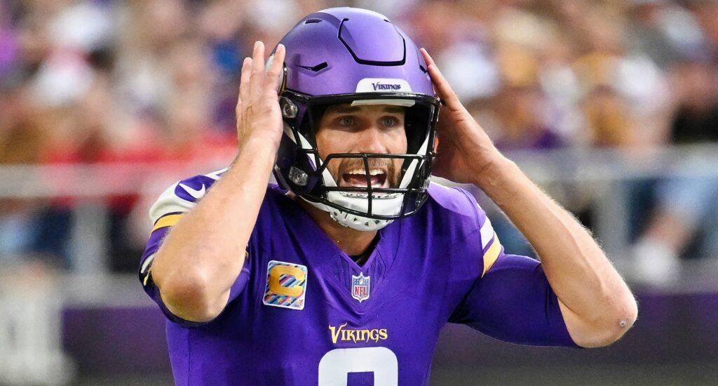Kirk Cousins of Minnesota Vikings calling a play during game.