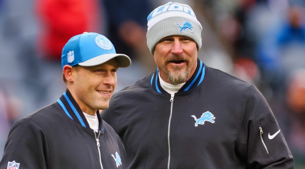 Detroit Lions offensive coordinator Ben Johnson (left) and head coach Dan Campbell (right) looking on.