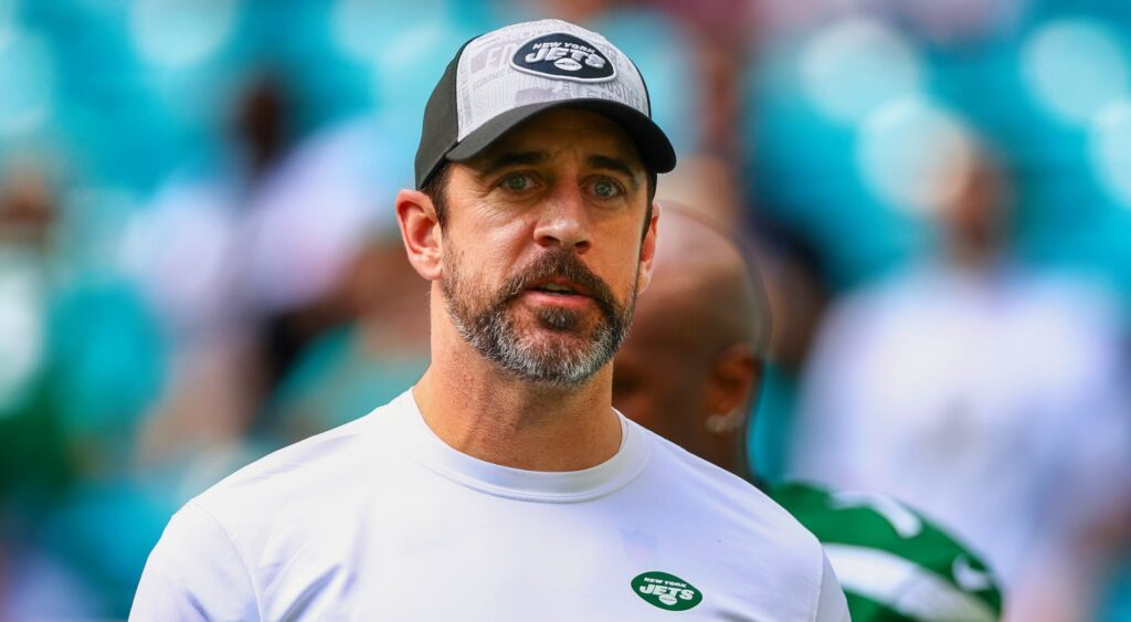 Aaron Rodgers of New York Jets looking on.