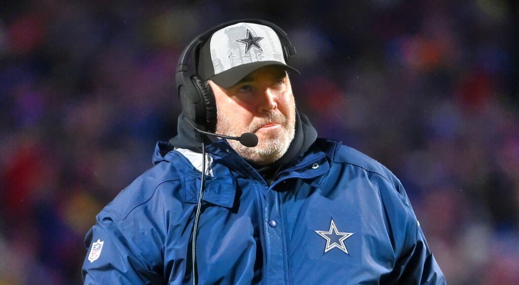 Mike McCarthy of Dallas Cowboys looking on.
