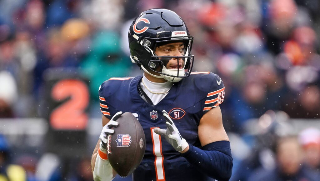 Justin Fields of Chicago Bears holding football.