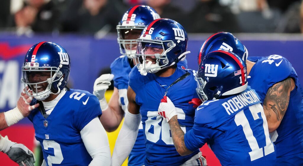 New York Giants players celebrating a touchdown.