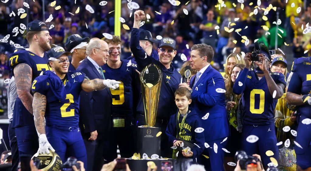 Jim Harbaugh and Michigan on stage after winning national championship.