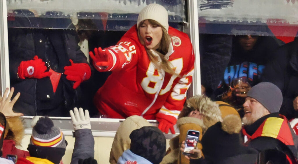 Taylor Swift celebrating with Chiefs fans