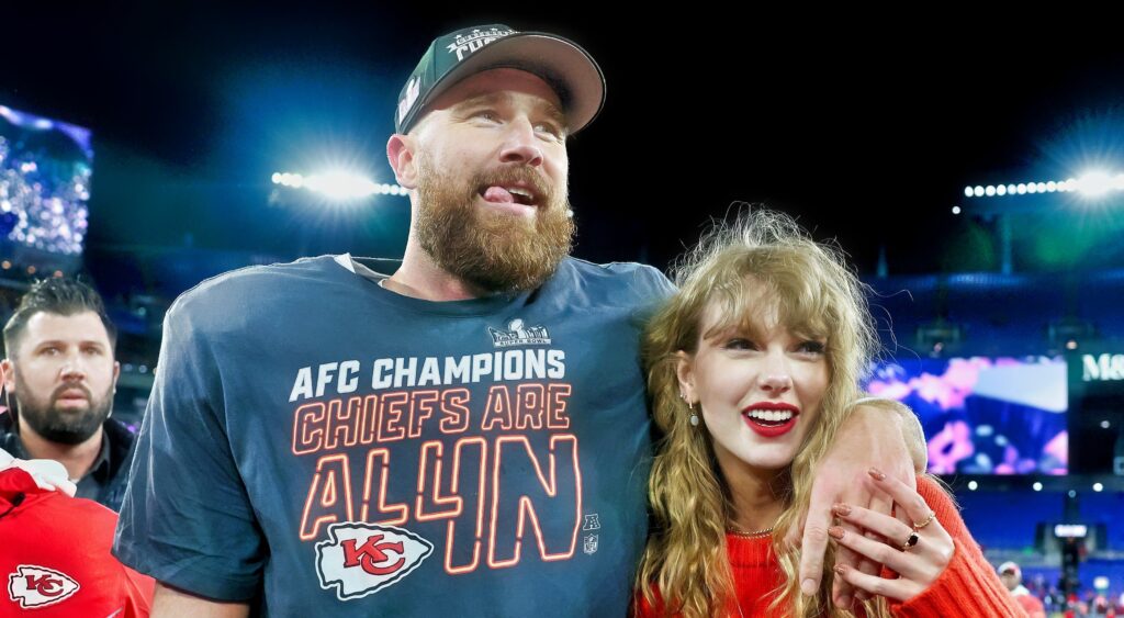 Travis Kelce (left) and Taylor Swift (right) looking on.