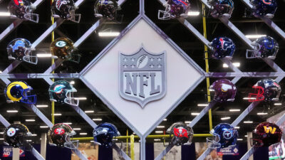 NFL helmets around NFL logo