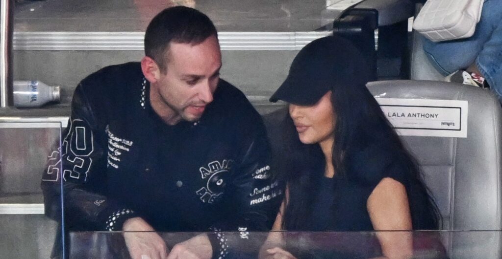 Kim Kardashian (right) and Michael Rubin (left) watching Super Bowl 58.