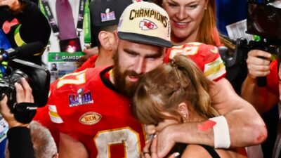 Travis Kelce and Taylor Swift hugging after Super Bowl