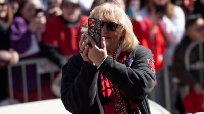 Donna Kelce taking picture at parade
