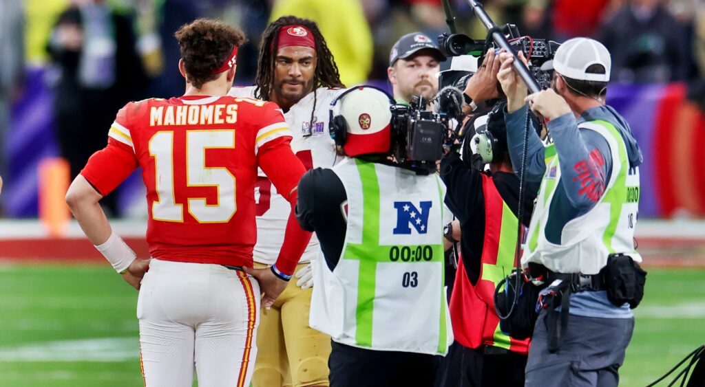 Patrick Mahomes and Fred Warner meeting at Super Bowl overtime coin toss.