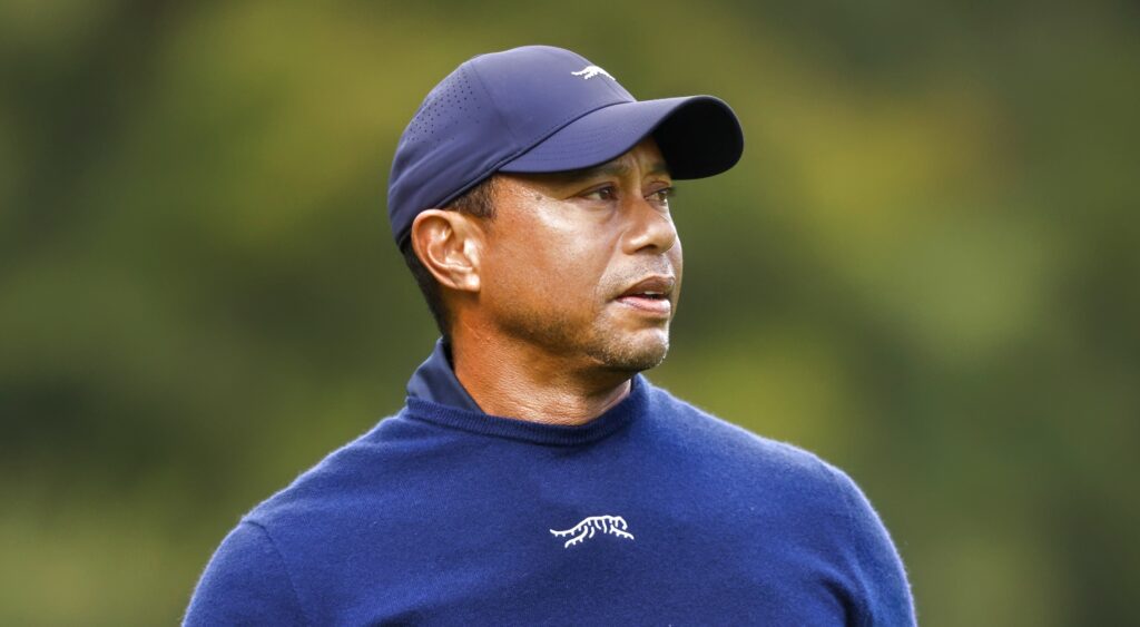Tiger Woods looking on during golf event.
