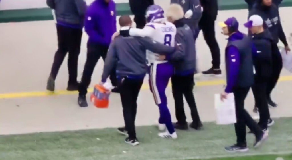 Kirk Cousins being helped after injury