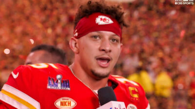 Patrick Mahomes speaking into microphone