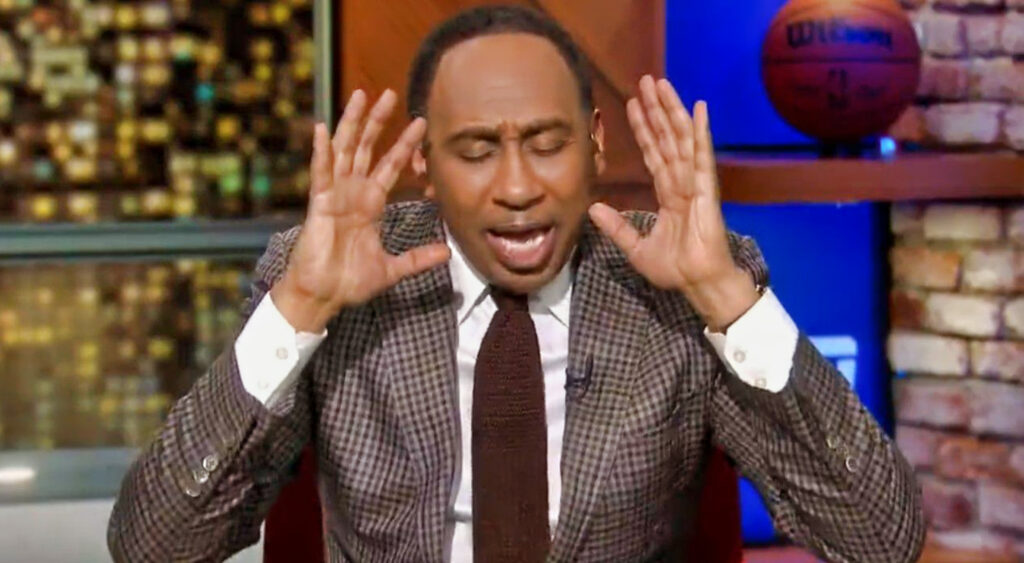 Stephen A. Smith with his hands near his head