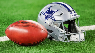 Cowboys helmet next to ball