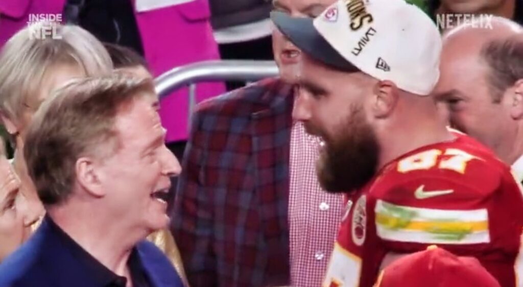 Travis Kelce and Roger Goodell talking at Super Bowl