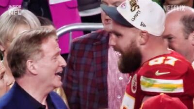 Travis Kelce and Roger Goodell talking at Super Bowl