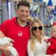 patrick mahomes and Brittany posing with kids
