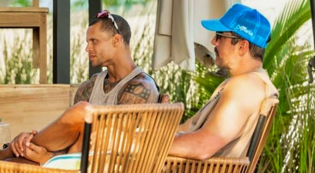 Jordan Poyer and Aaron Rodgers sitting at a table