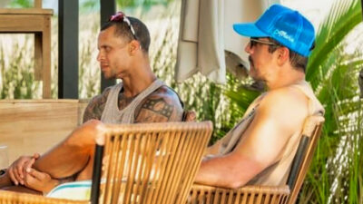 Jordan Poyer and Aaron Rodgers sitting at a table