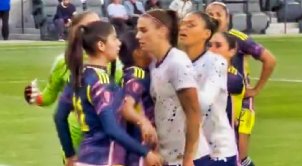 Alex Morgan getting in the face of an opposing player