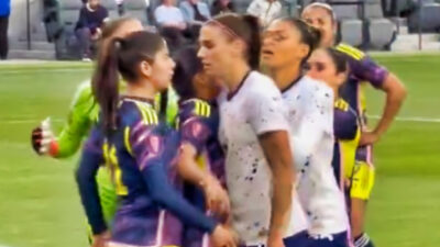 Alex Morgan getting in the face of an opposing player