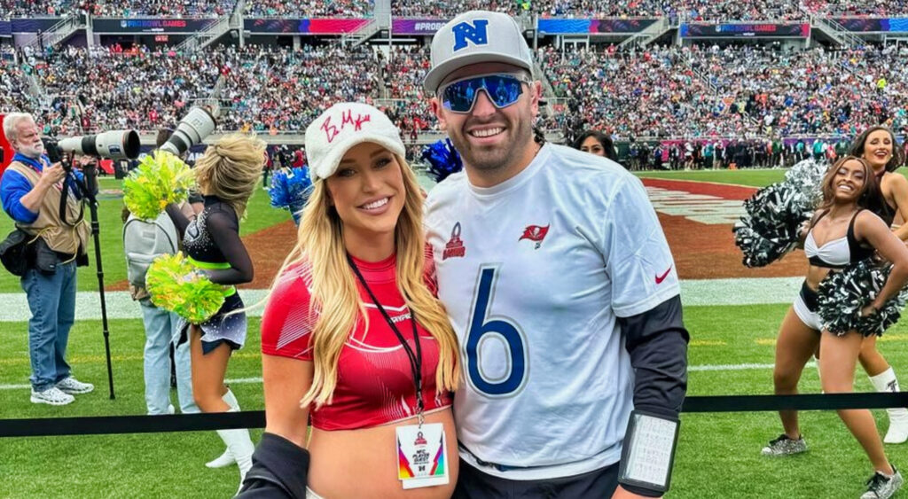 Baker Mayfield posing with his wife