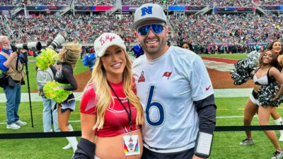 Baker Mayfield posing with his wife