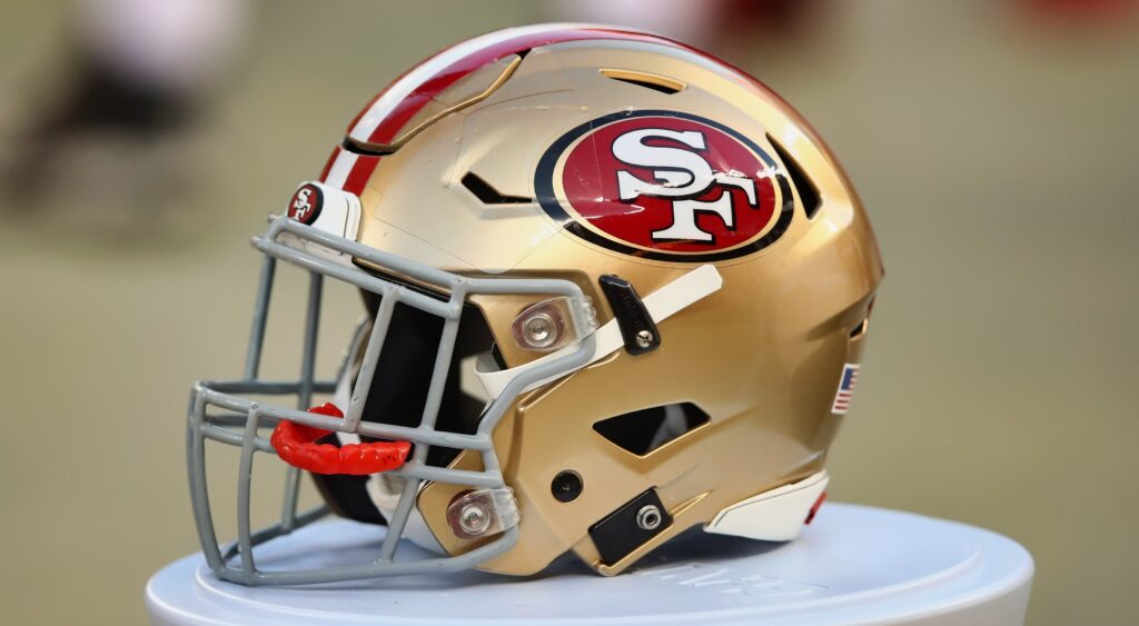 San Francisco 49ers helmet shown on field.