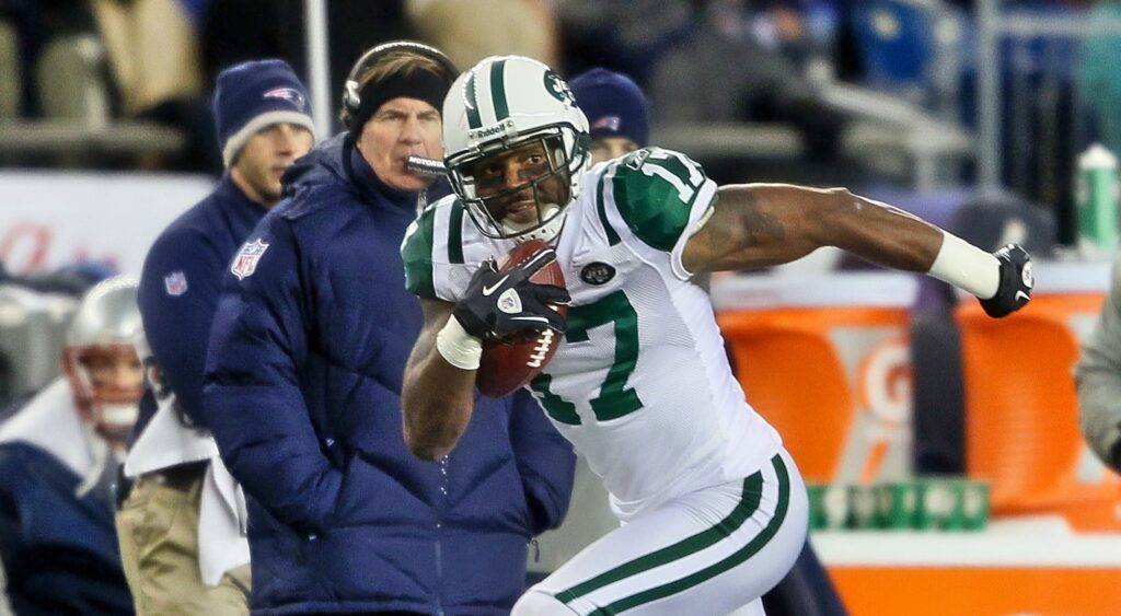 Braylon Edwards of New York Jets running with football.