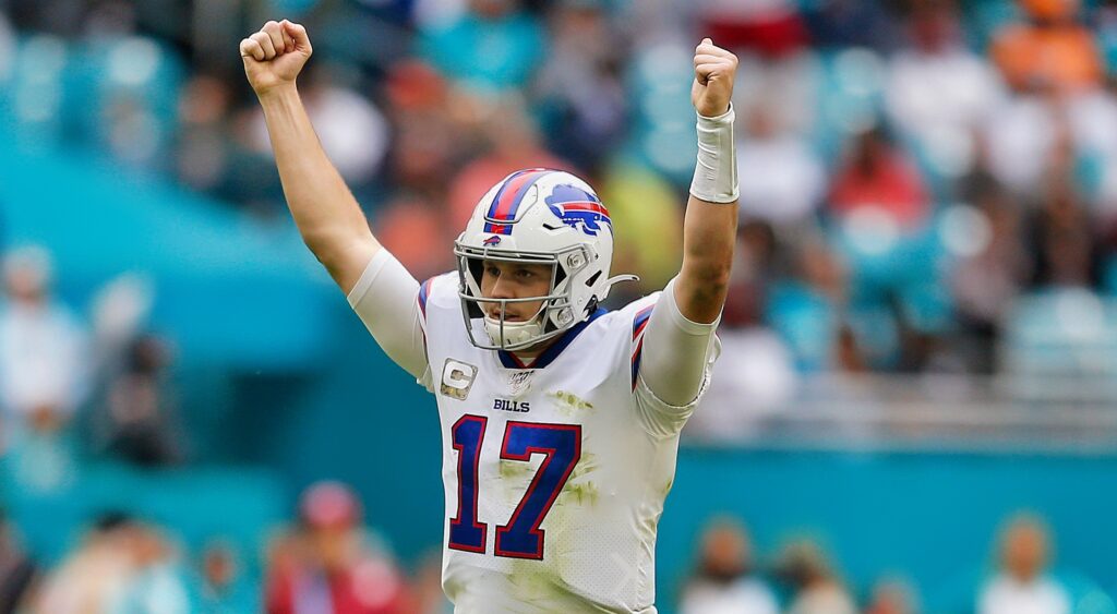 Josh Allen of Buffalo Bills celebrates with arms in the air.